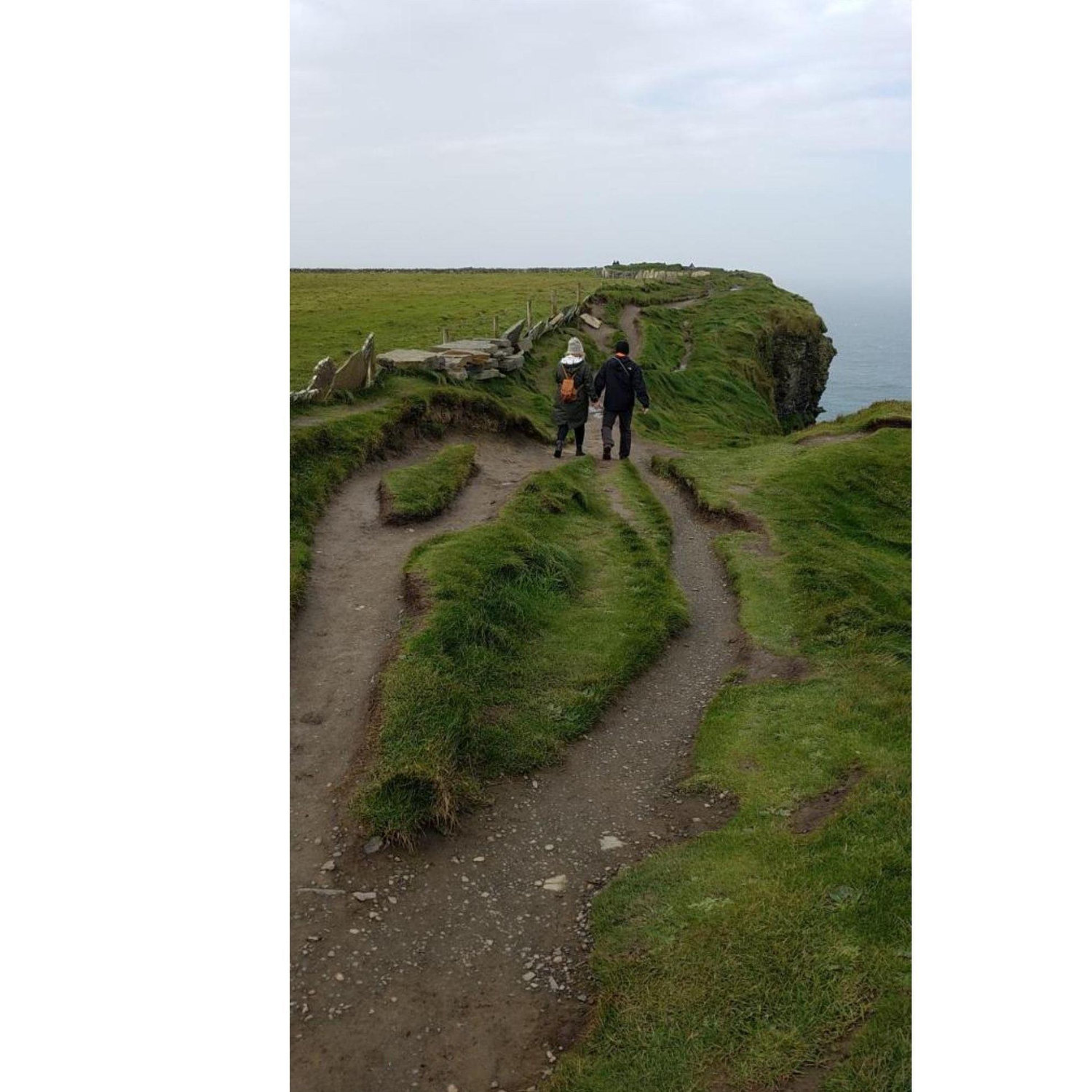 A stranger took our photo as we walked along the cliffs of Moher