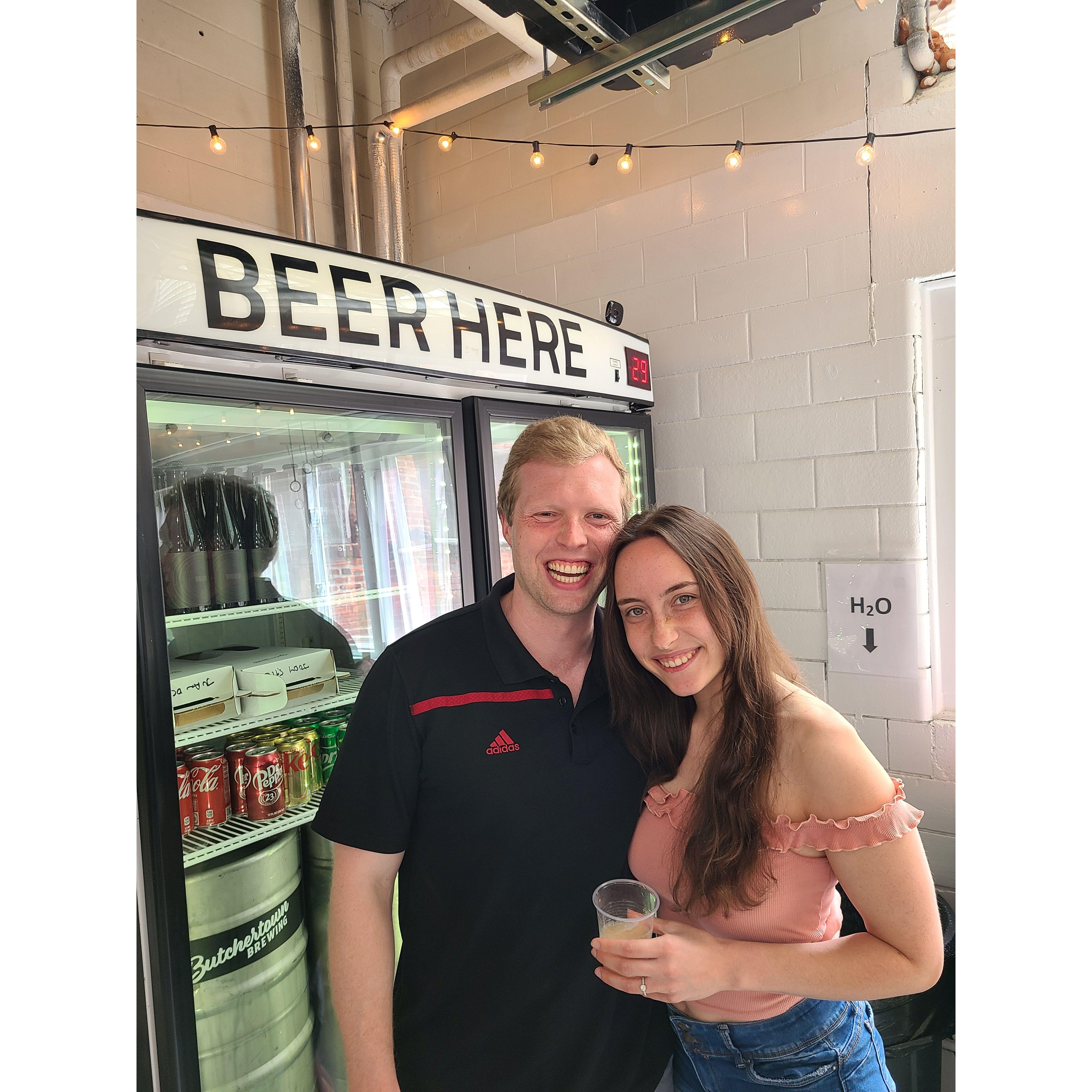 Riley and Anna partake in a craft beer tasting in Louisville, KY during a summer 2022 weekend trip.