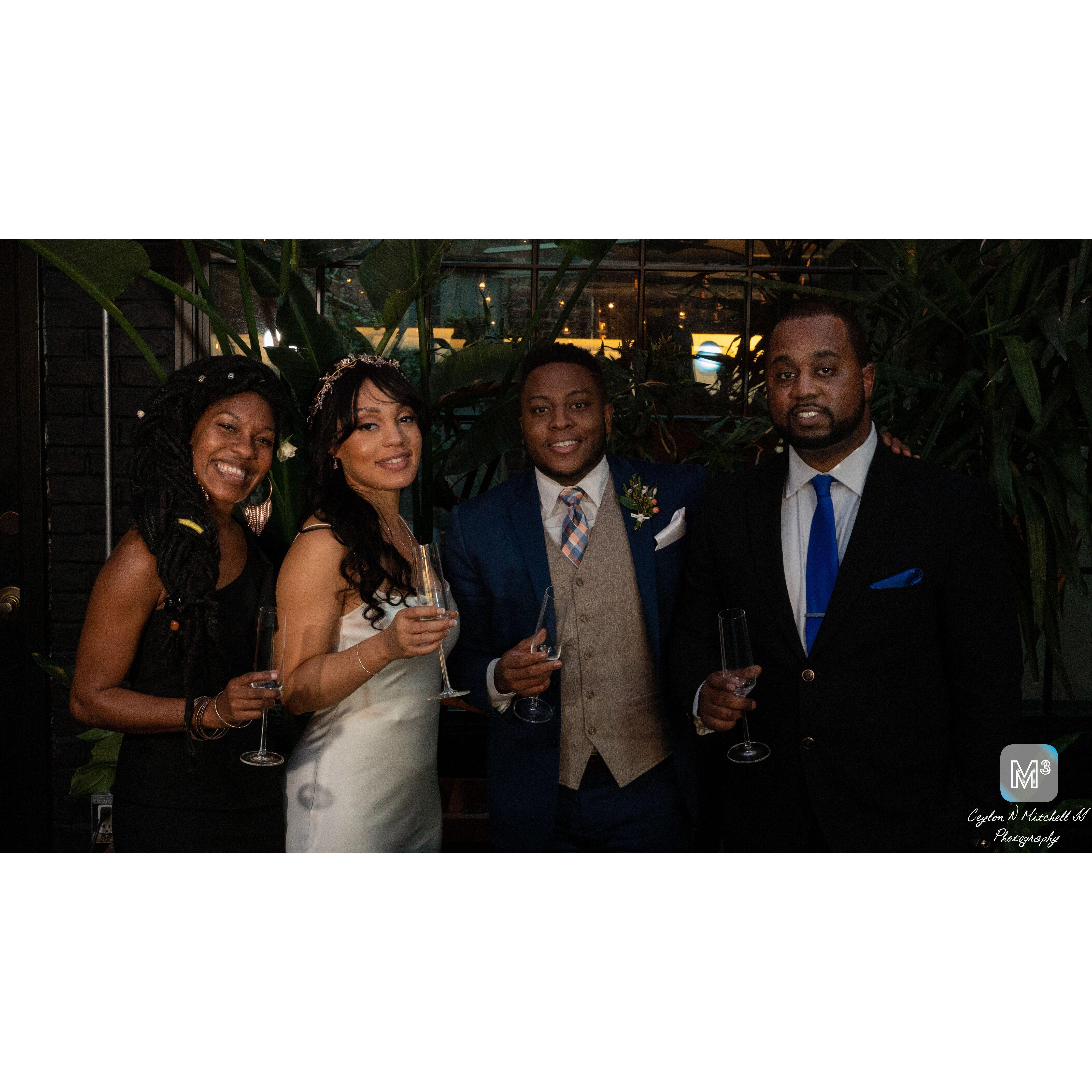 The wedding party is all smiles.