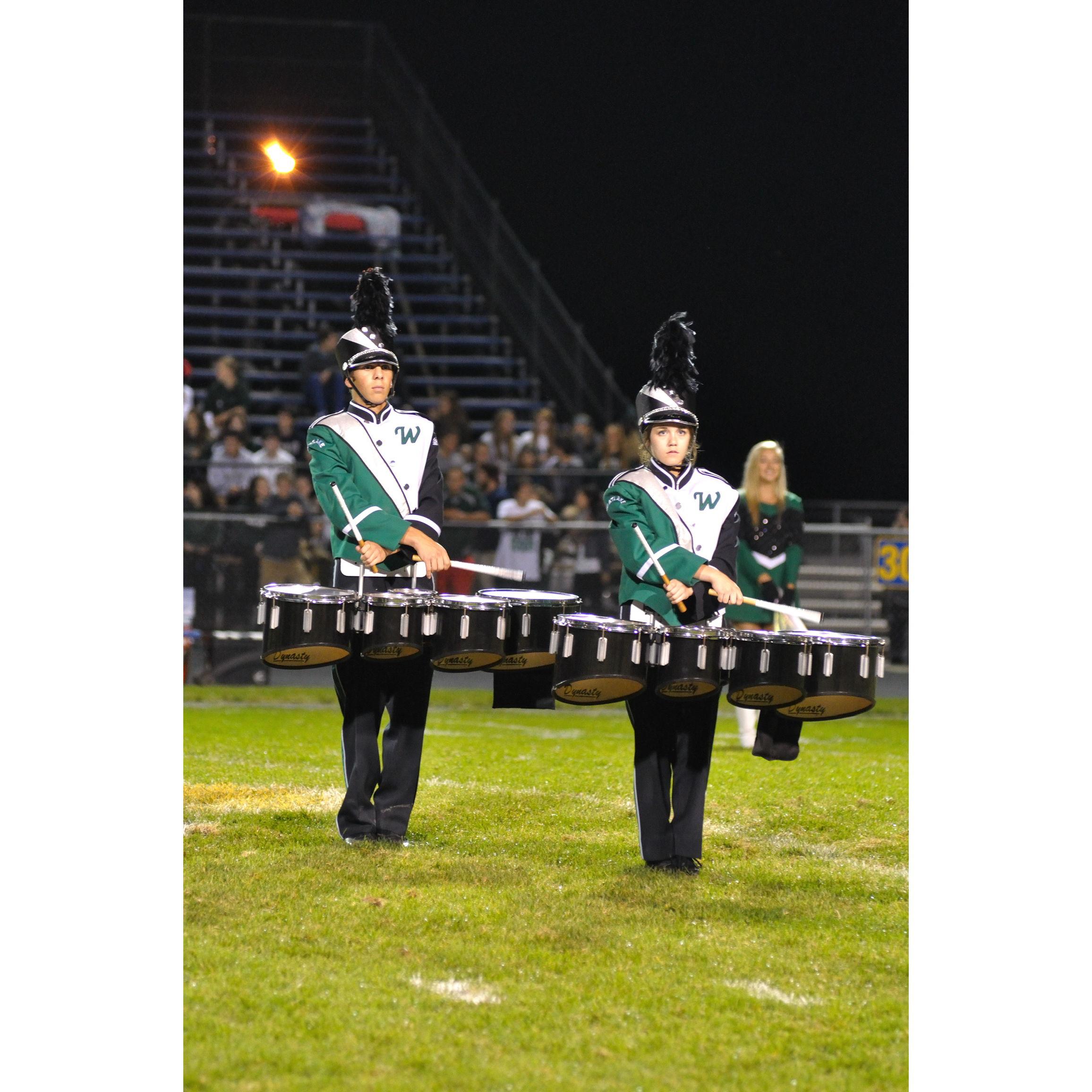Dominic waited to ask Sam out because she was better at drums than him.
(see Dominic's pinky in this picture for more information)