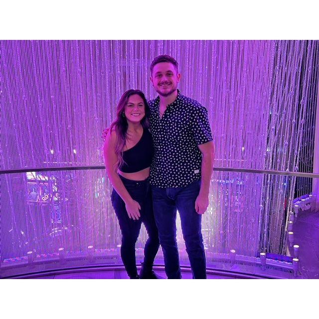 In front of the iconic Chandelier Bar in Vegas