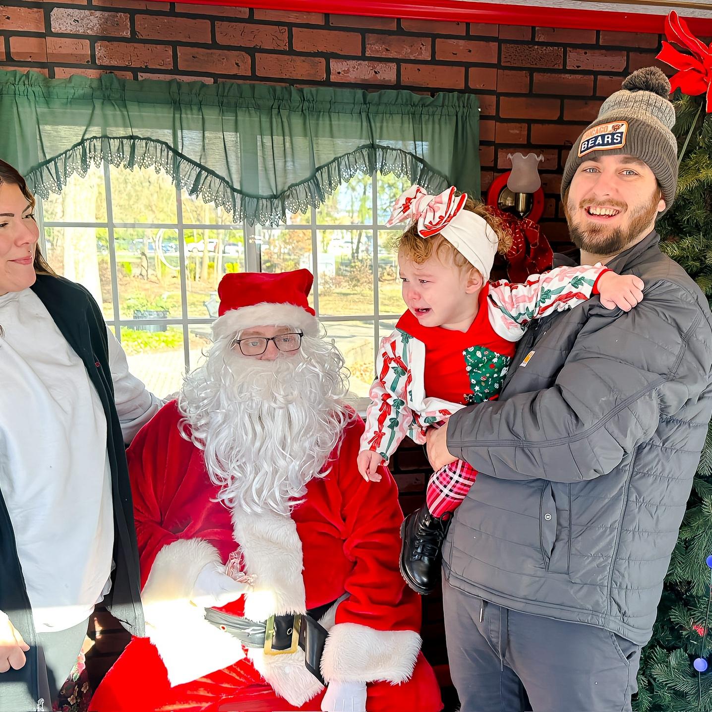 Eloise's 2nd time seeing Santa - NOT loving it.