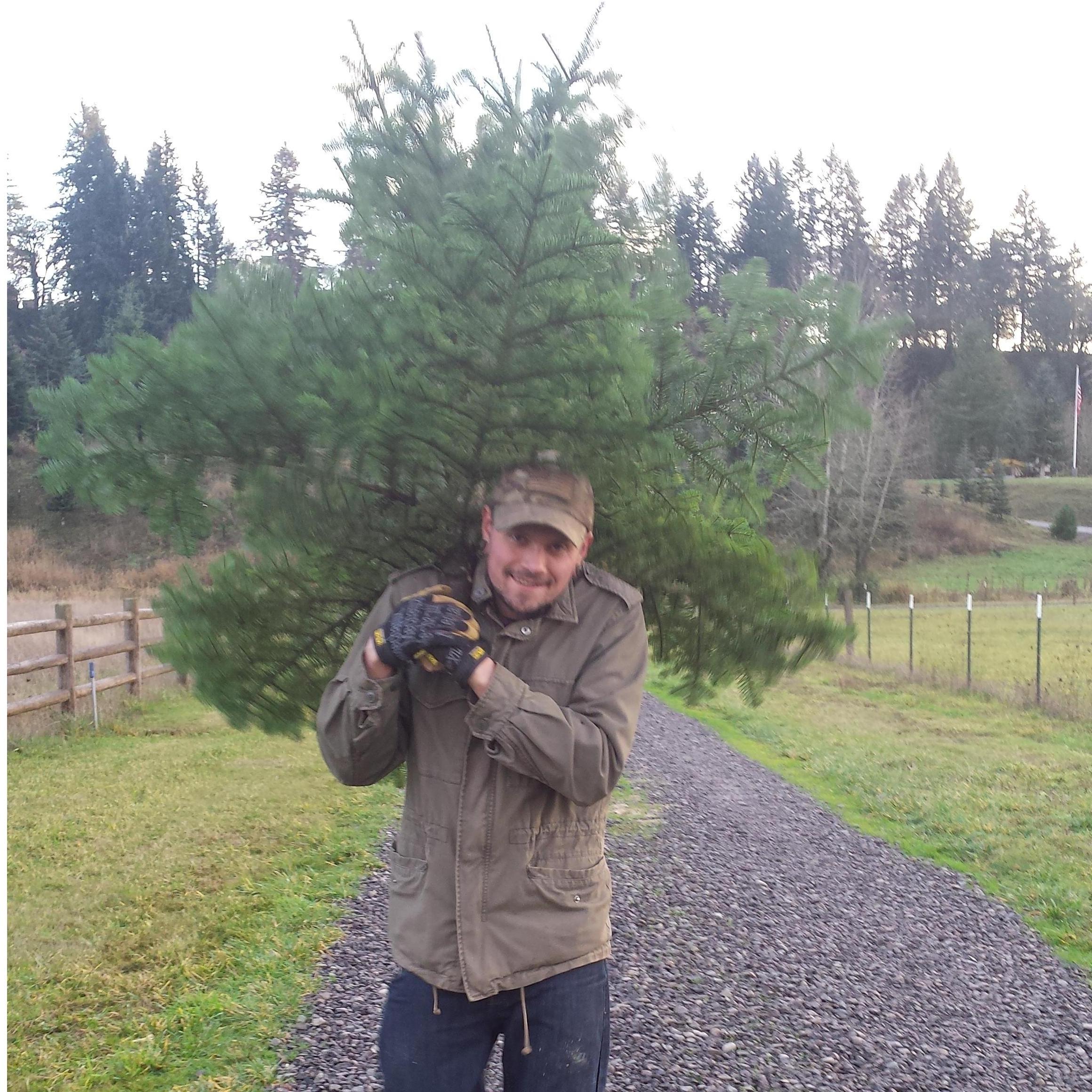 Kevin carrying our first Christmas Tree together