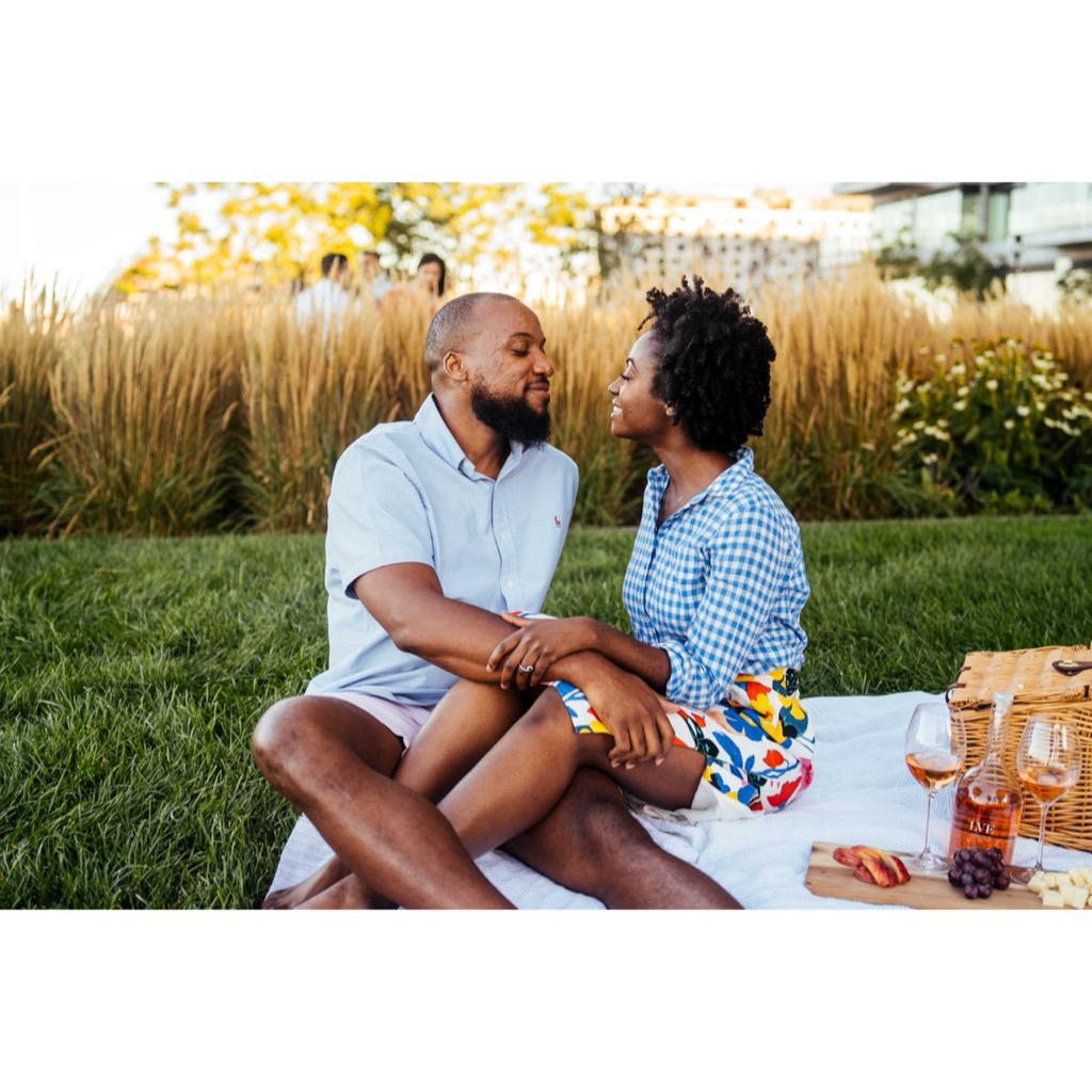 This picnic is actually a patch of grass in front of an apartment building.
