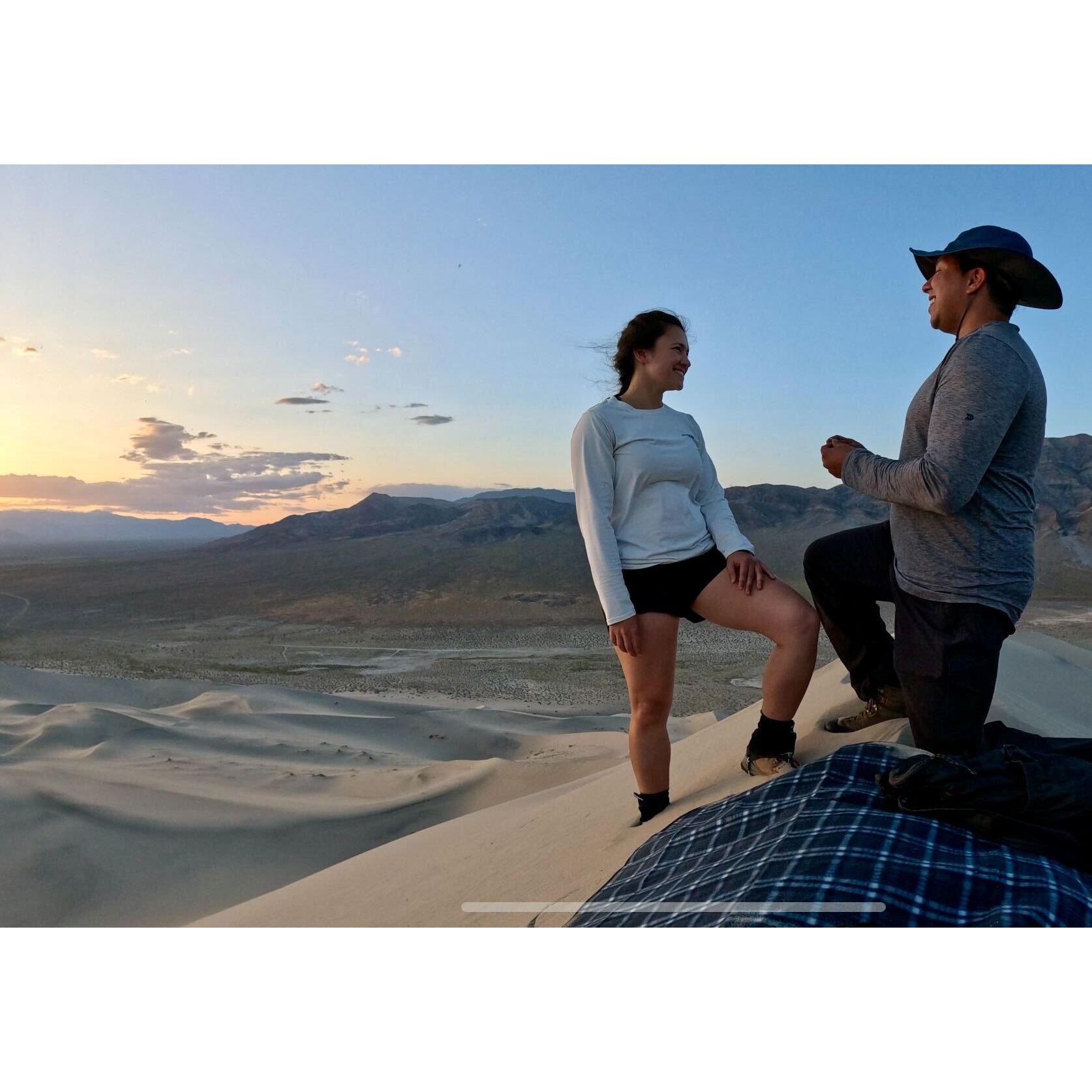 Sunset proposal at the highest point of Eureka Dunes in Death Valley National Park.