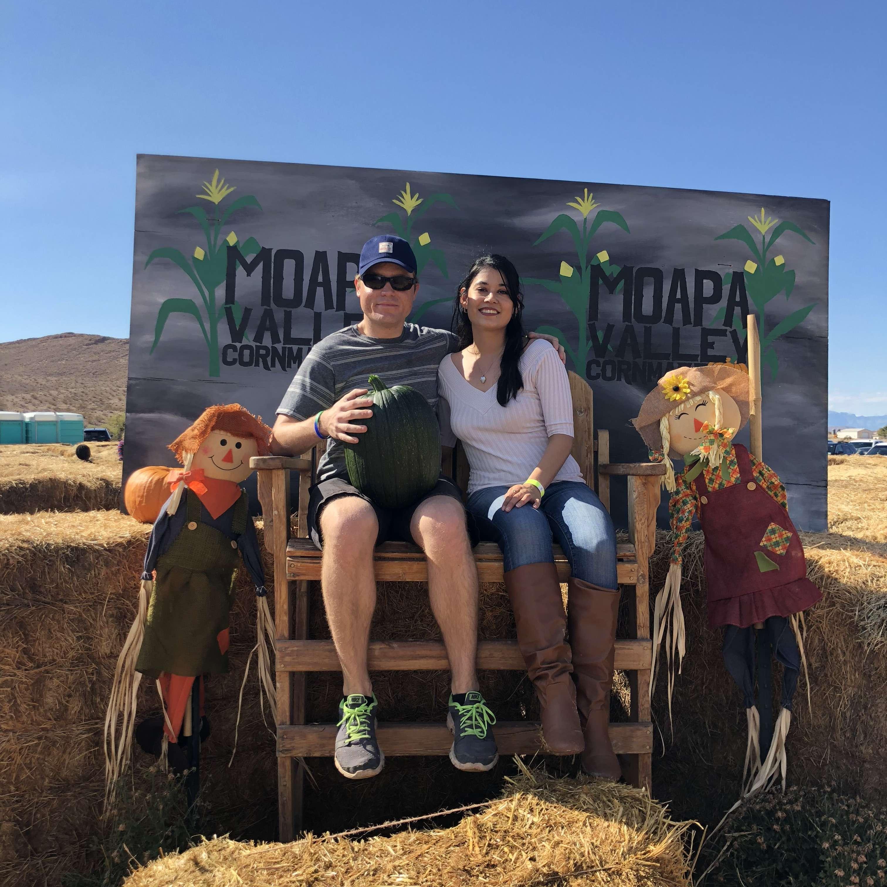 Visiting a pumpkin patch in October.