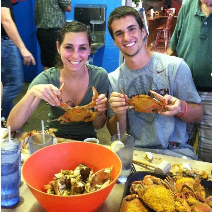 Cameron getting initiated into the Hutzfam with his first crab feast!