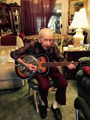 Gary’s dad playing his guitar.