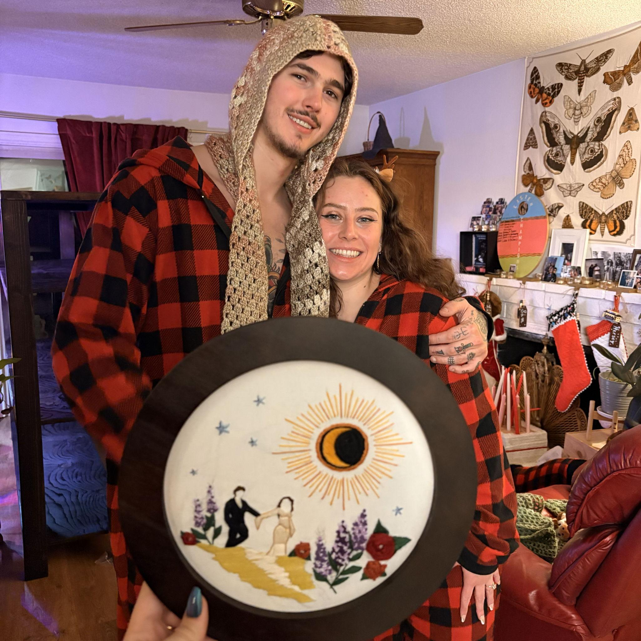 Christmas 2025. My maid of honor needlepointed our engagement photos for christmas.