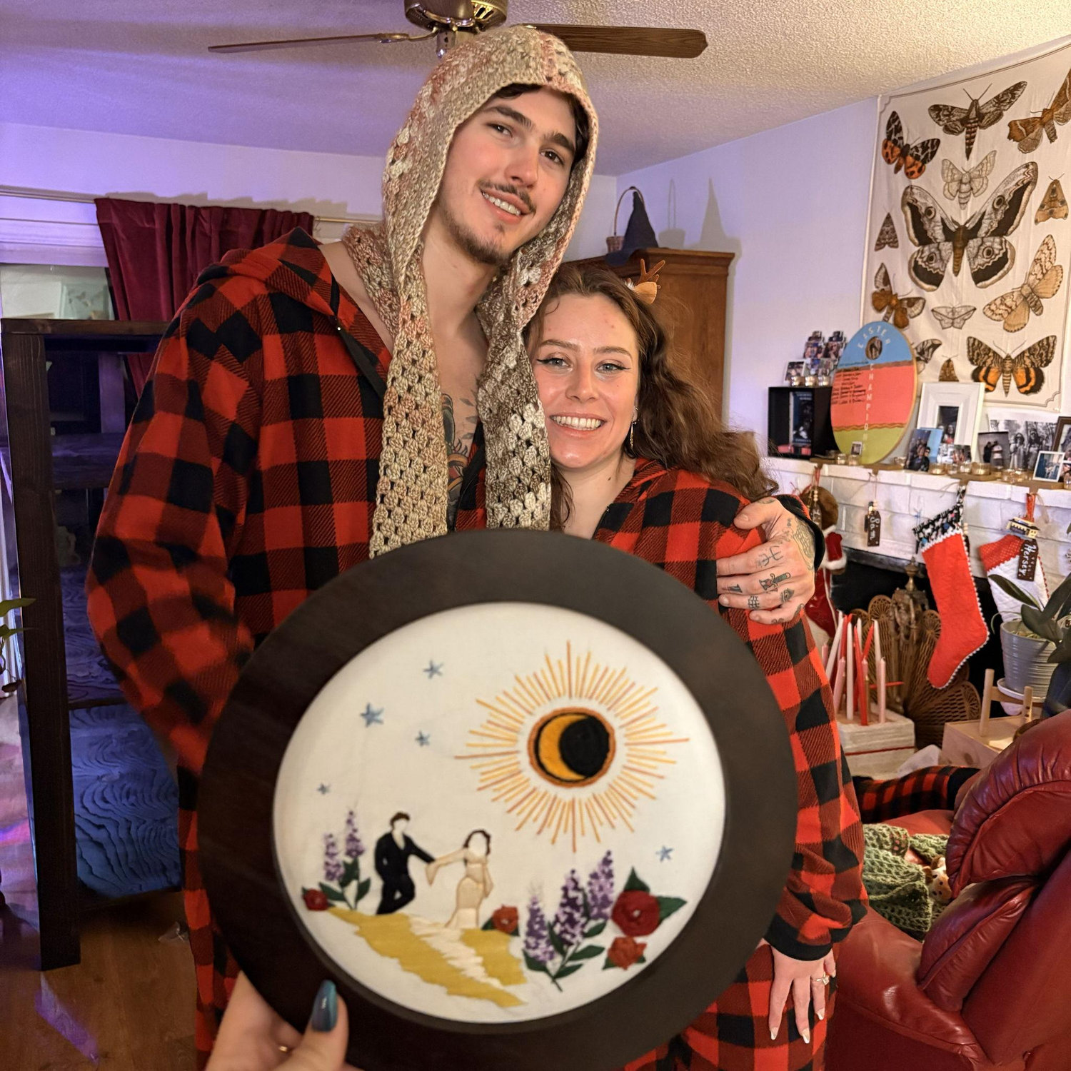 Christmas 2025. My maid of honor needlepointed our engagement photos for christmas.