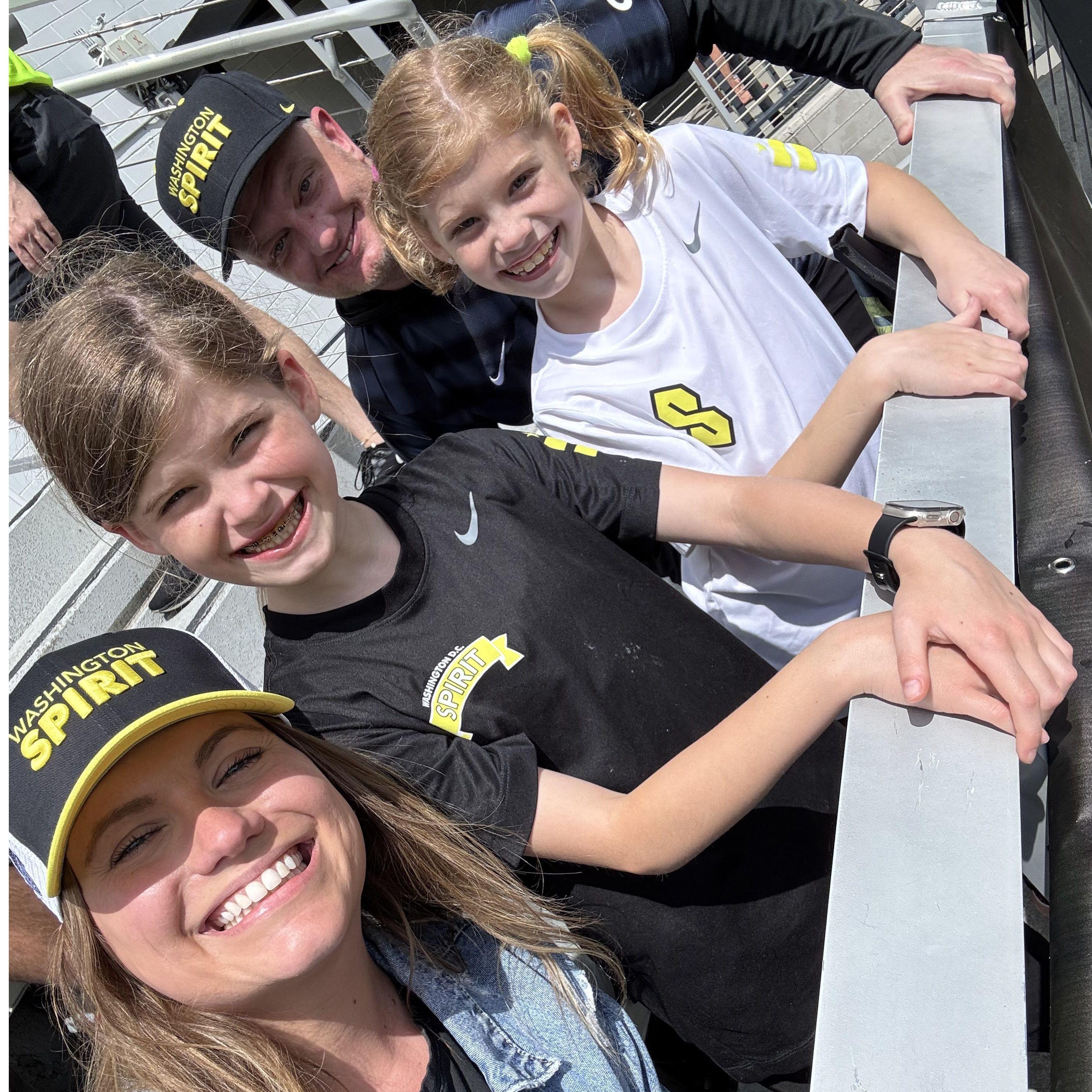Sneaking the girls into our section at Rowdy Audi (less than 10 minutes later it was absolutely POURING rain).
