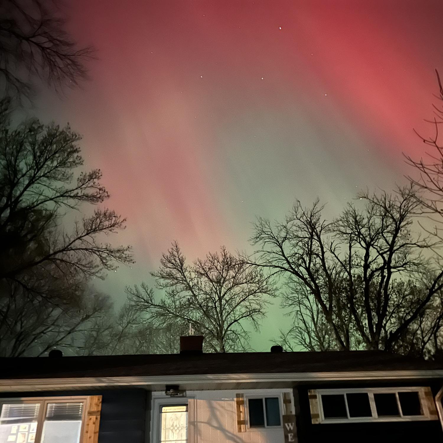 the northern lights over the amazing home we made for ourselves