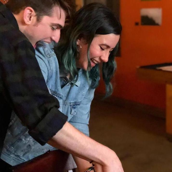 Cutting the cake at our engagement party. We might be a little excited.