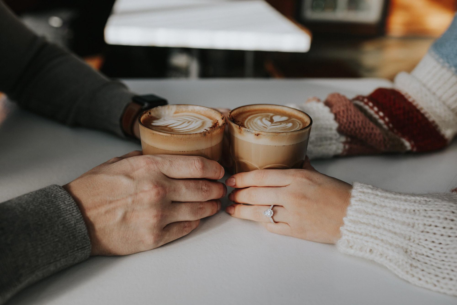 Enjoying the warm coffee before they face the cold to finish their engagement photos