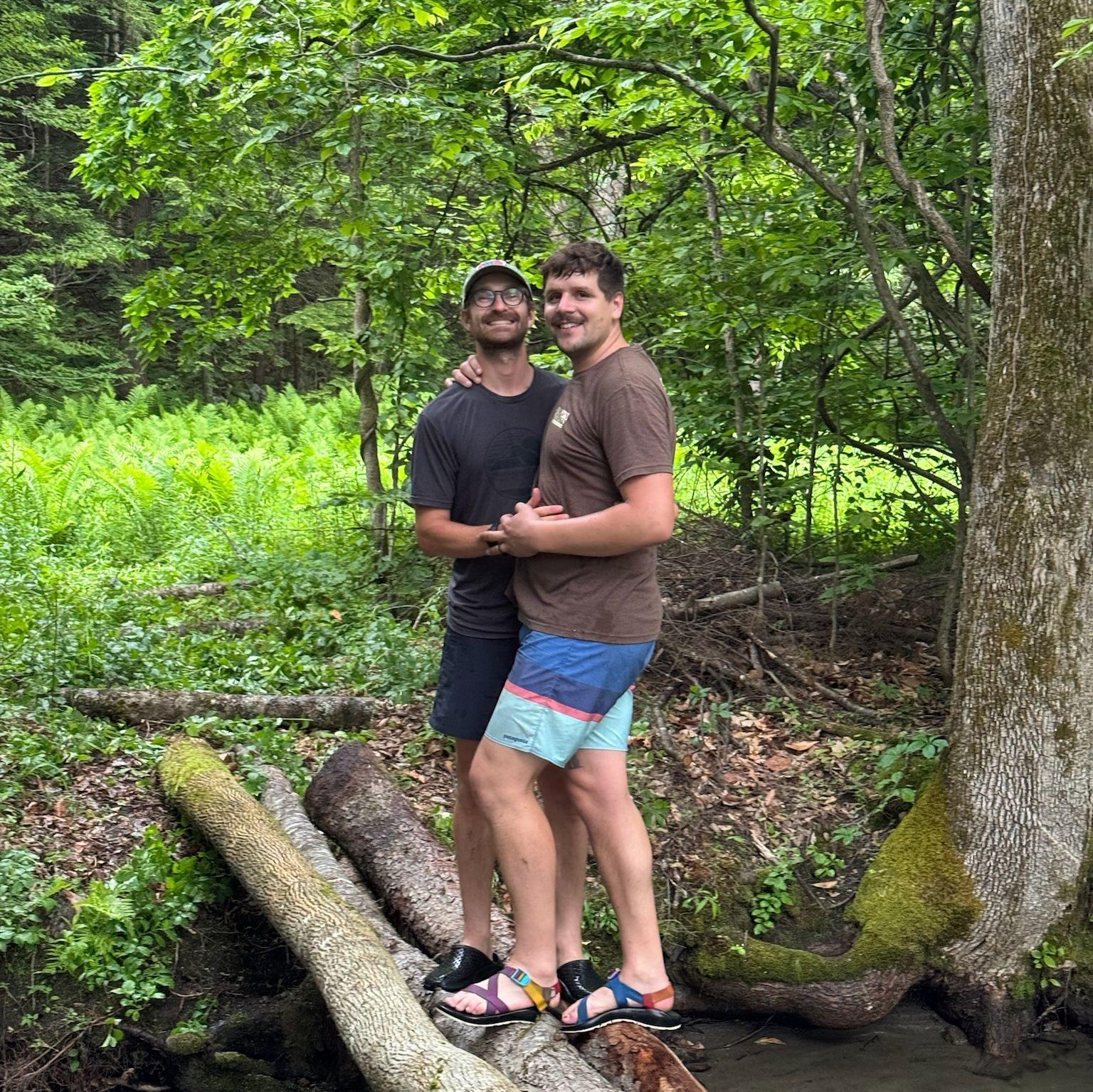 Standing on a bridge we helped build in our friend Comma's backyard