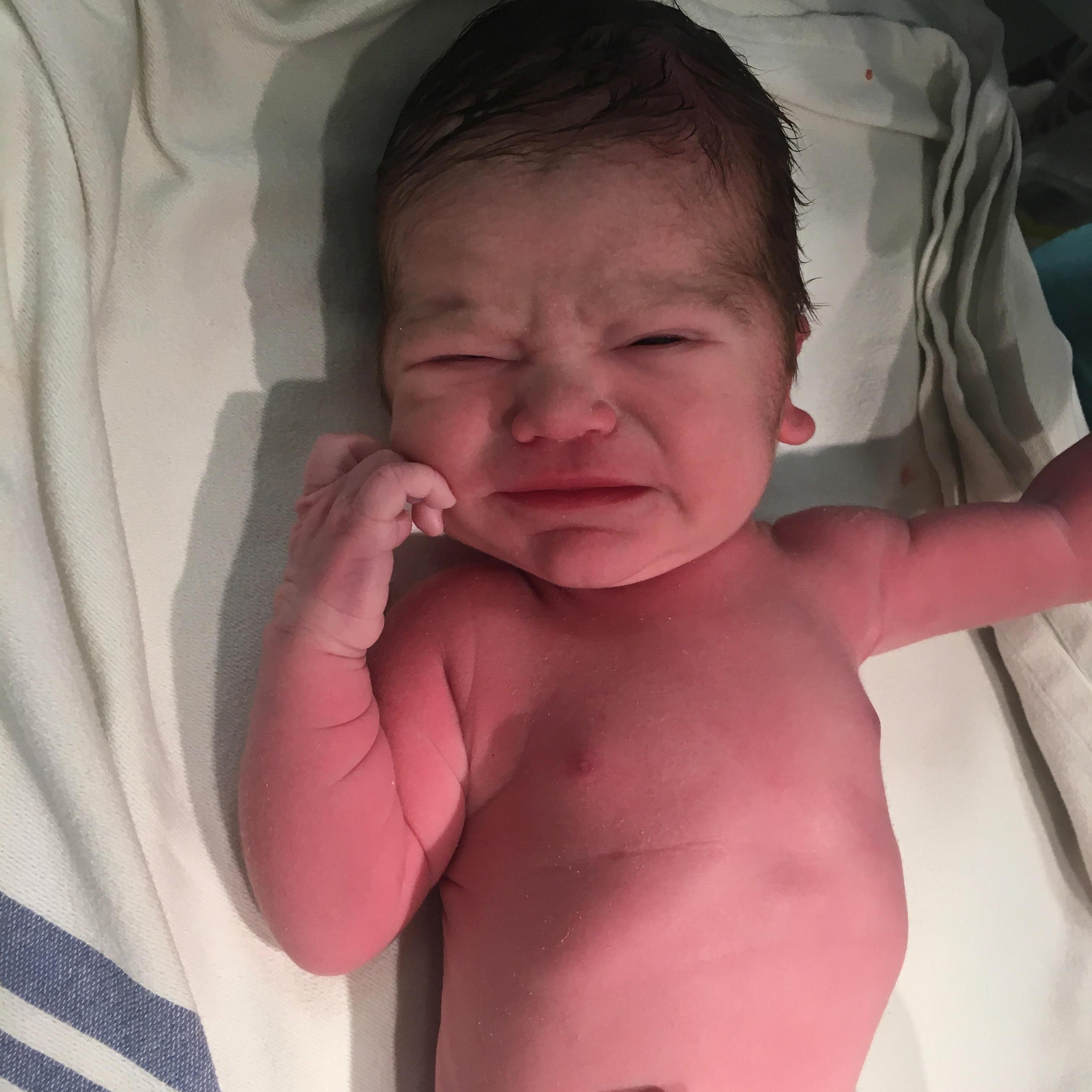 our little man after he was delivered via emergency C section. one of the nurses was kind enough to snap some photos of him after they delivered him!