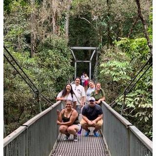 On a bridge in the rainforest in Australia. We do not know those people behind us.