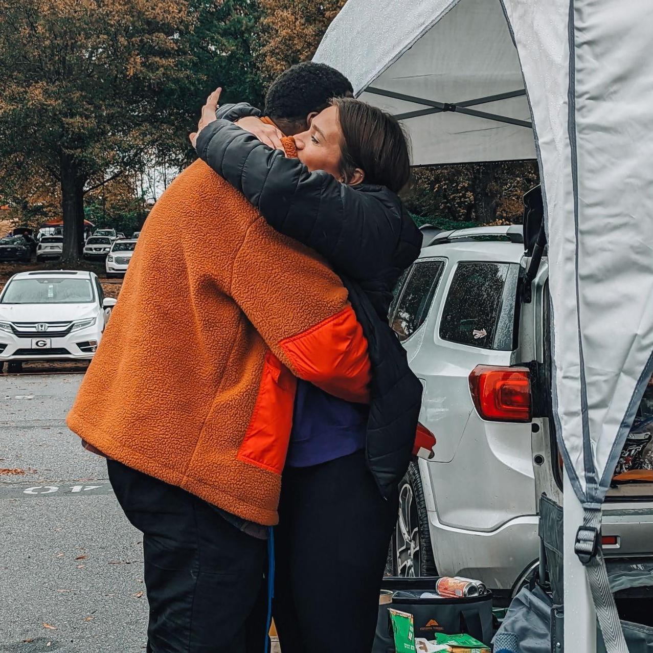 Jonathan proposed at a Clemson football game. Eliza thought he was just upset about the cold weather and that's why he was quiet, but it was really because he had something amazing planned.