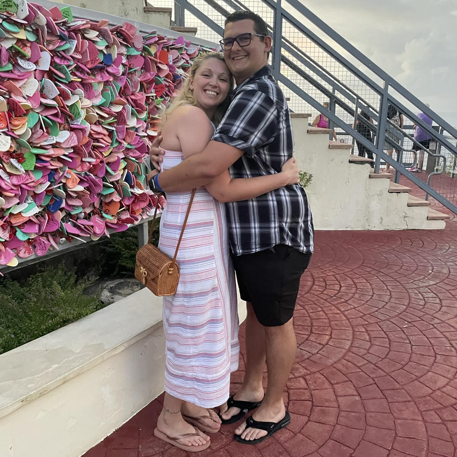 Attaching our (first) heart on the fence at Puntan Dos Amantes. Two Lovers’ Point, Guam.