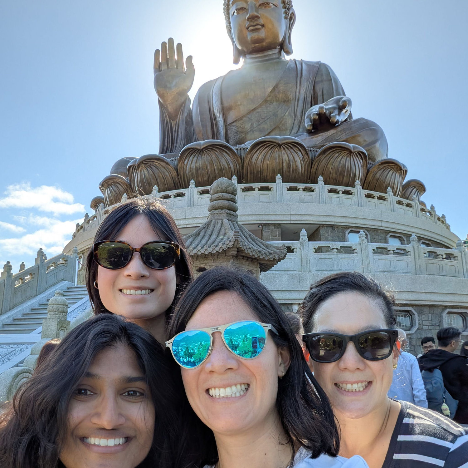 Saying hi to the big Buddha with sisters.
