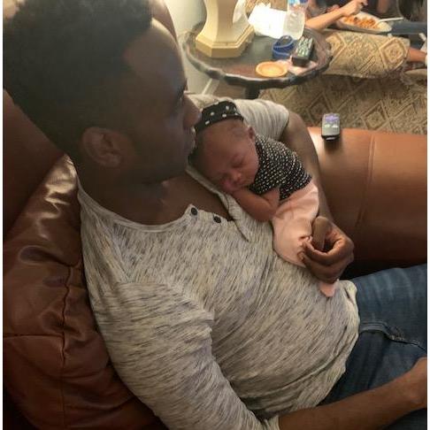Raisu putting his niece to sleep