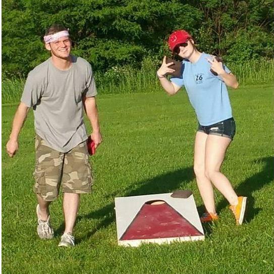"First time she was actually kicking my butt at a corn hole game. She was acting goofy and was getting cocky when her mom took this picture of us."