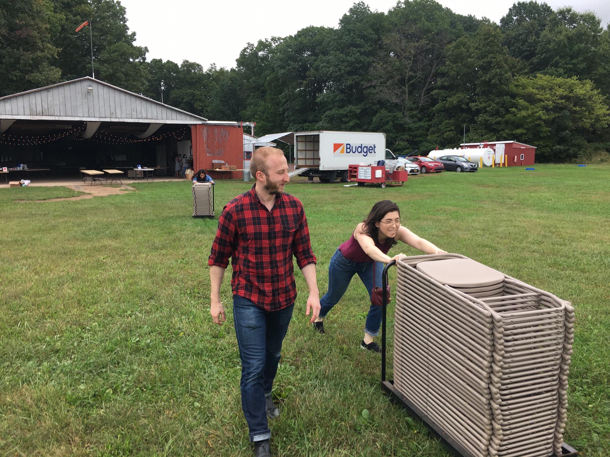 Here we are a setting up chairs for Liz and Andrew’s wedding in September, 2018. Please note: this image does not accurately represent the division of labor in our household.