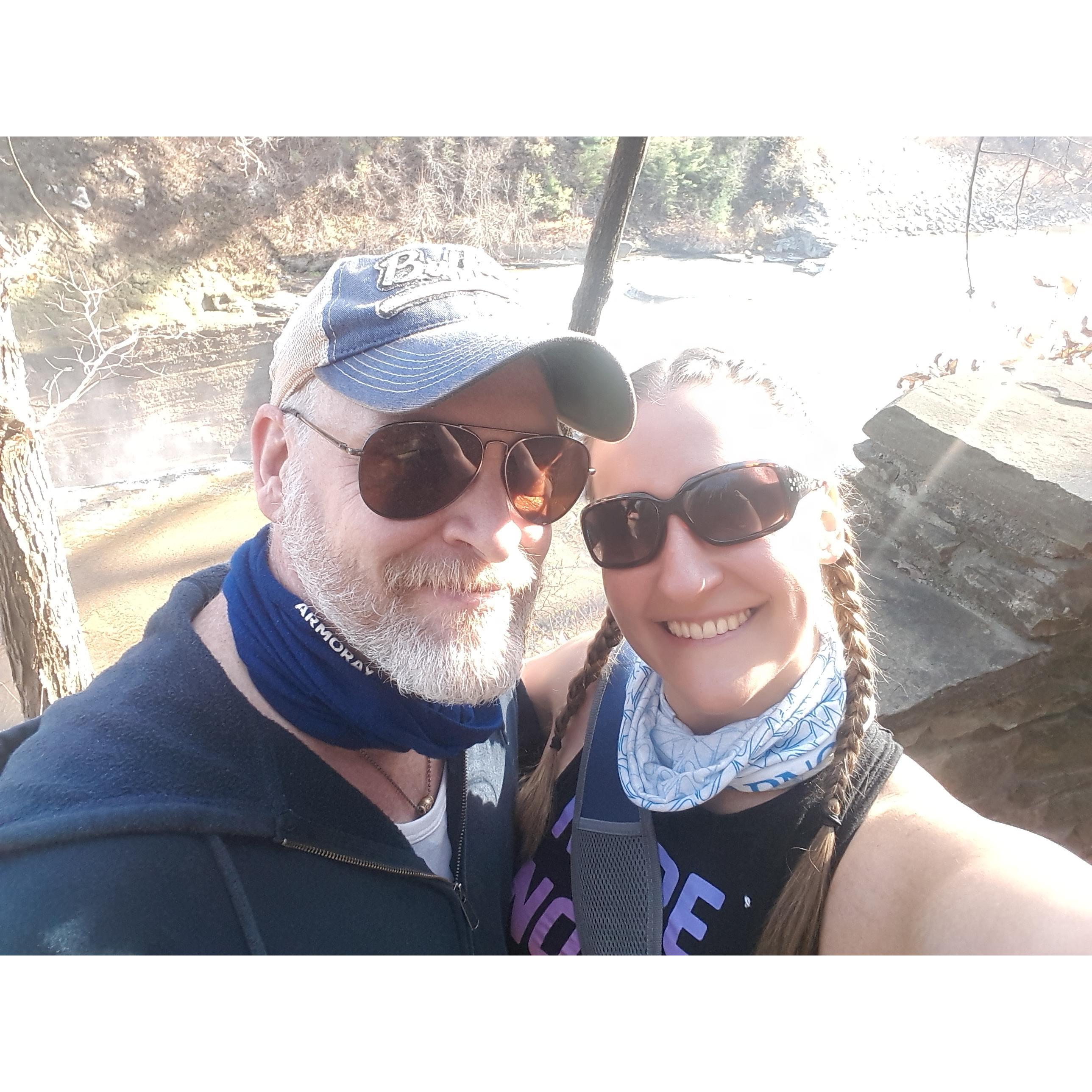 Our first photo together, while hiking at Letchworth State Park (2020). Boy is Tracy glad she snapped this photo!