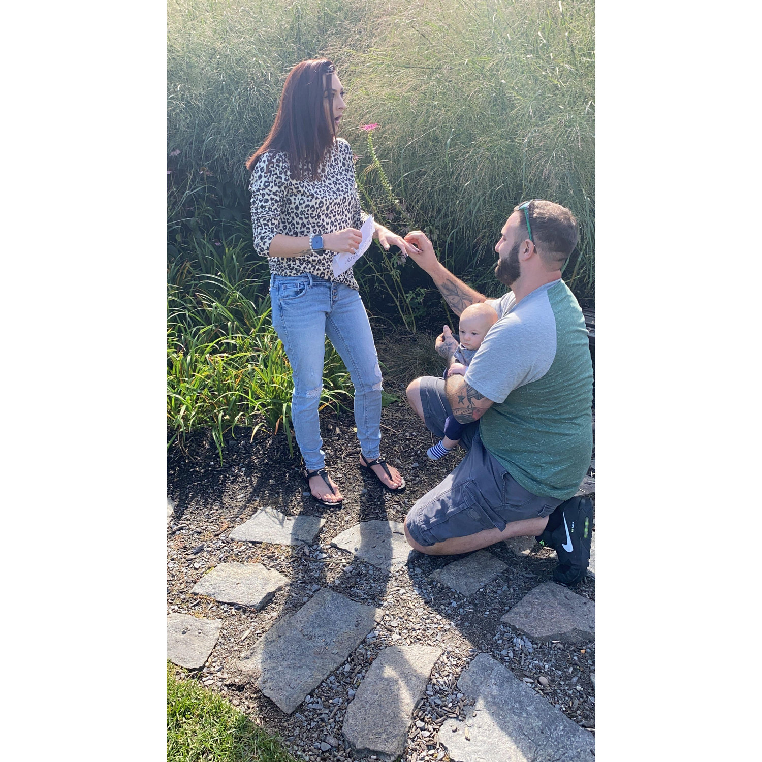 With our- 3 month old son right there with us he got down on one knee and asked me to marry him- making it one of the most special moments in our lives.