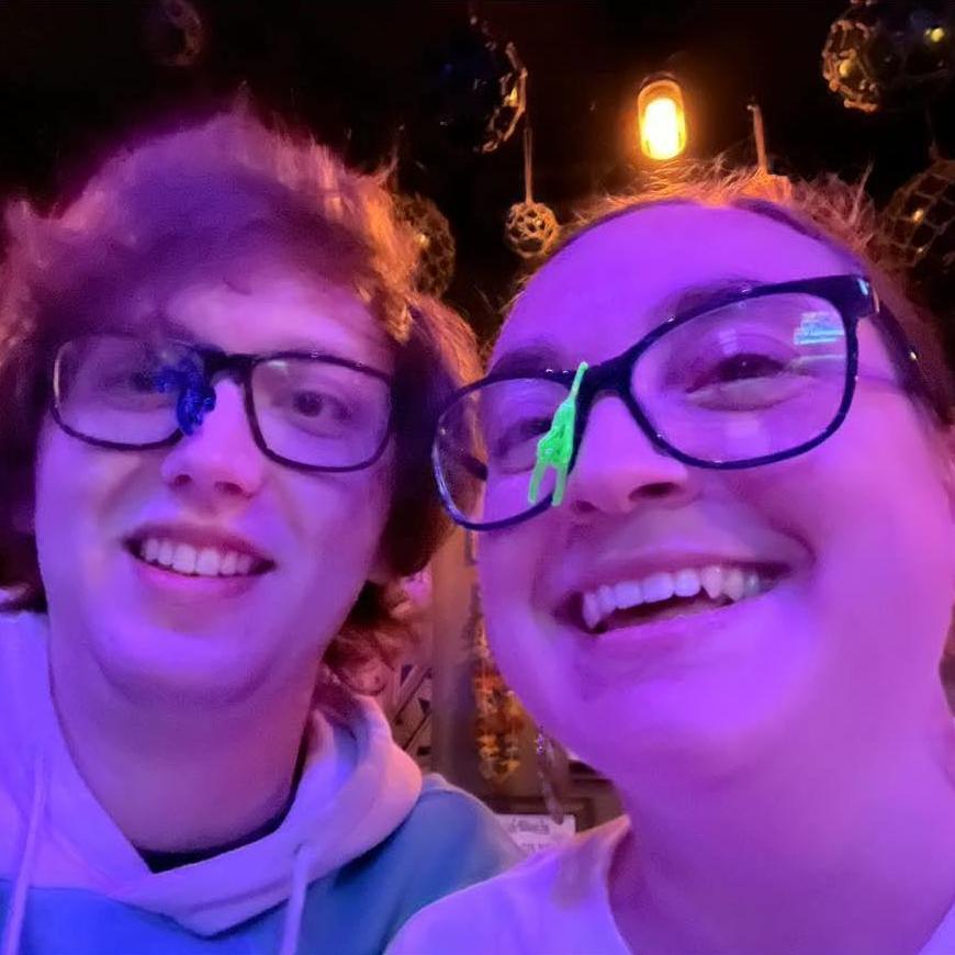 Goofing off hanging the monkeys from our drinks on our glasses at our favorite bar, the Monkey's Paw in Macon.