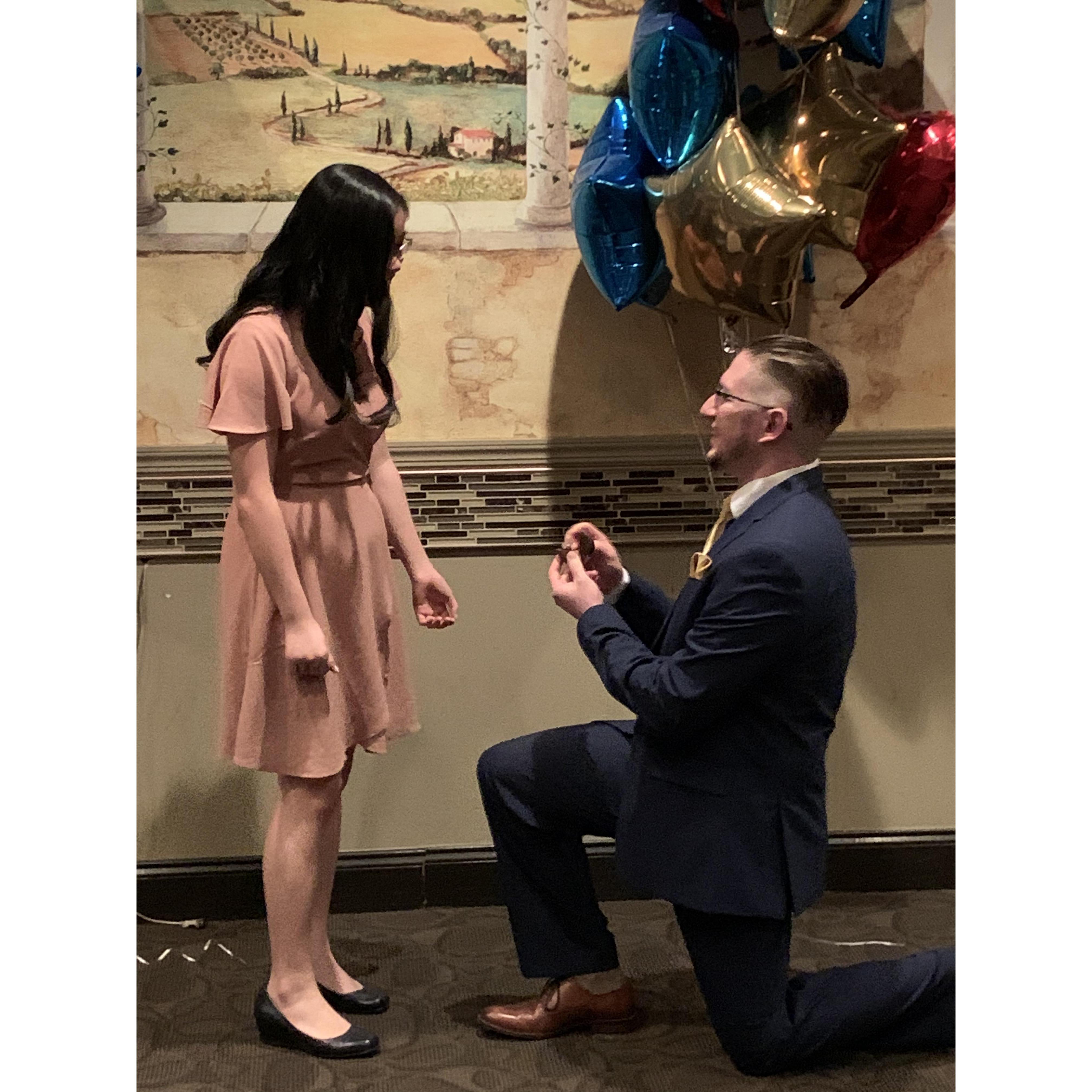 He popped the question hours after I got my white coat for pharmacy school! At a dinner with our families right after the ceremony.