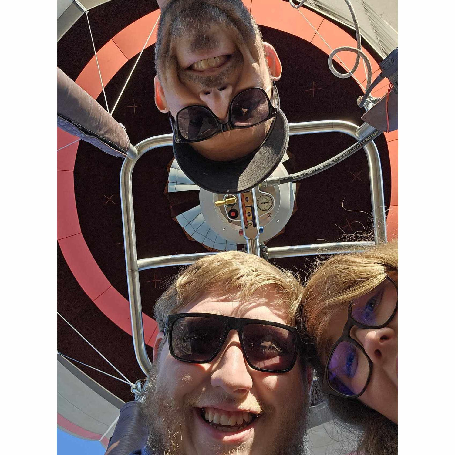 Brandon and Victoria is the hot air balloon that he proposed in along with their pilot Justin.