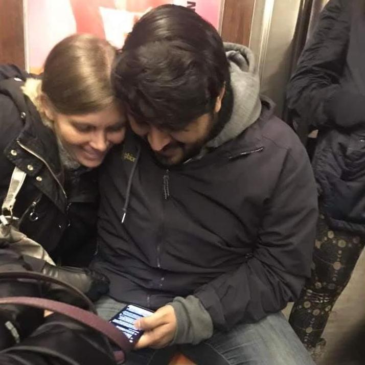 Riding the NY subway isn't always too bad - it's also a great time to snuggle and look at memes.