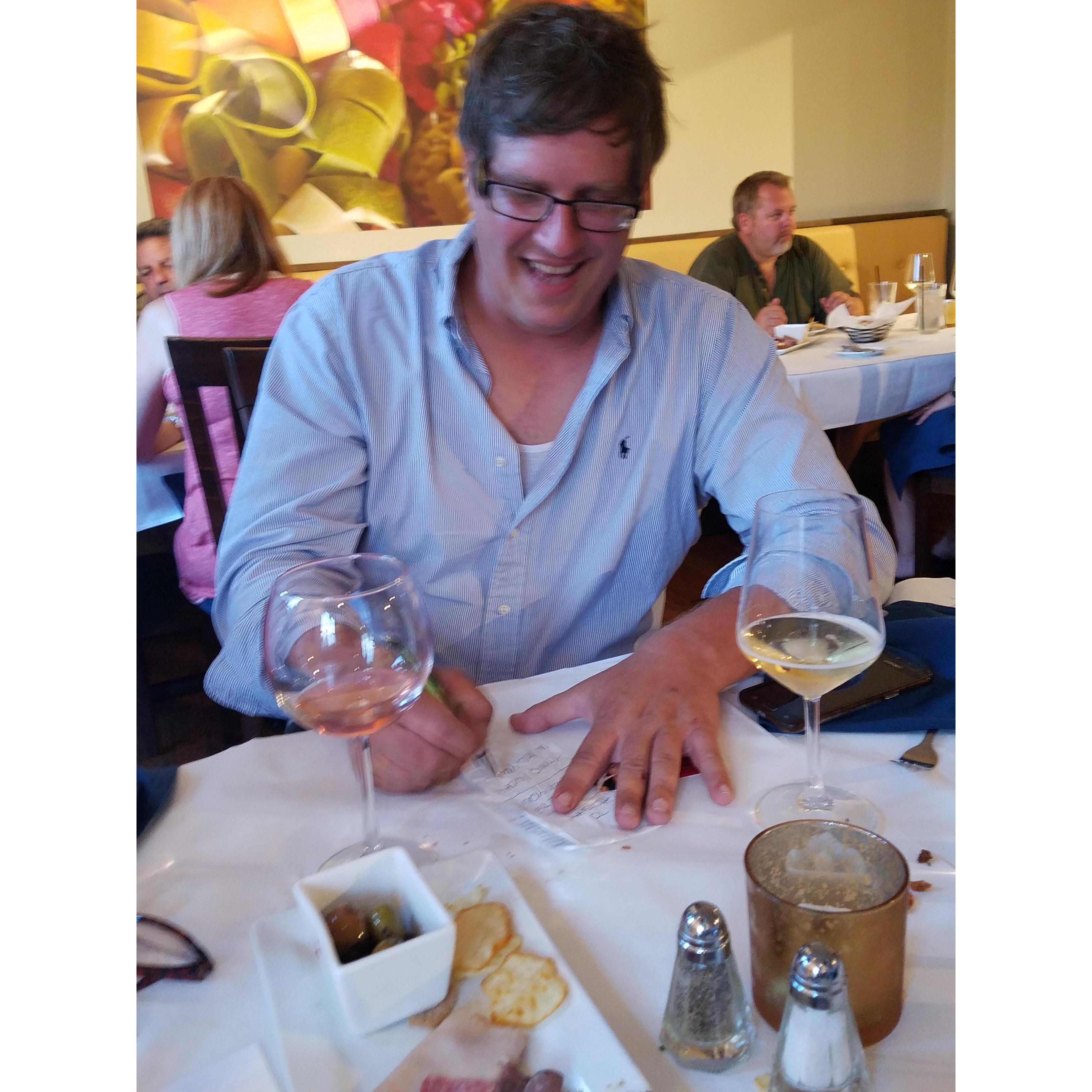 K & M met at this wine tasting because they got sat at the same table together. Here Matt is writing her (& other strangers ) a code to get on a nearby train. Said he knew the conductor. He lied....