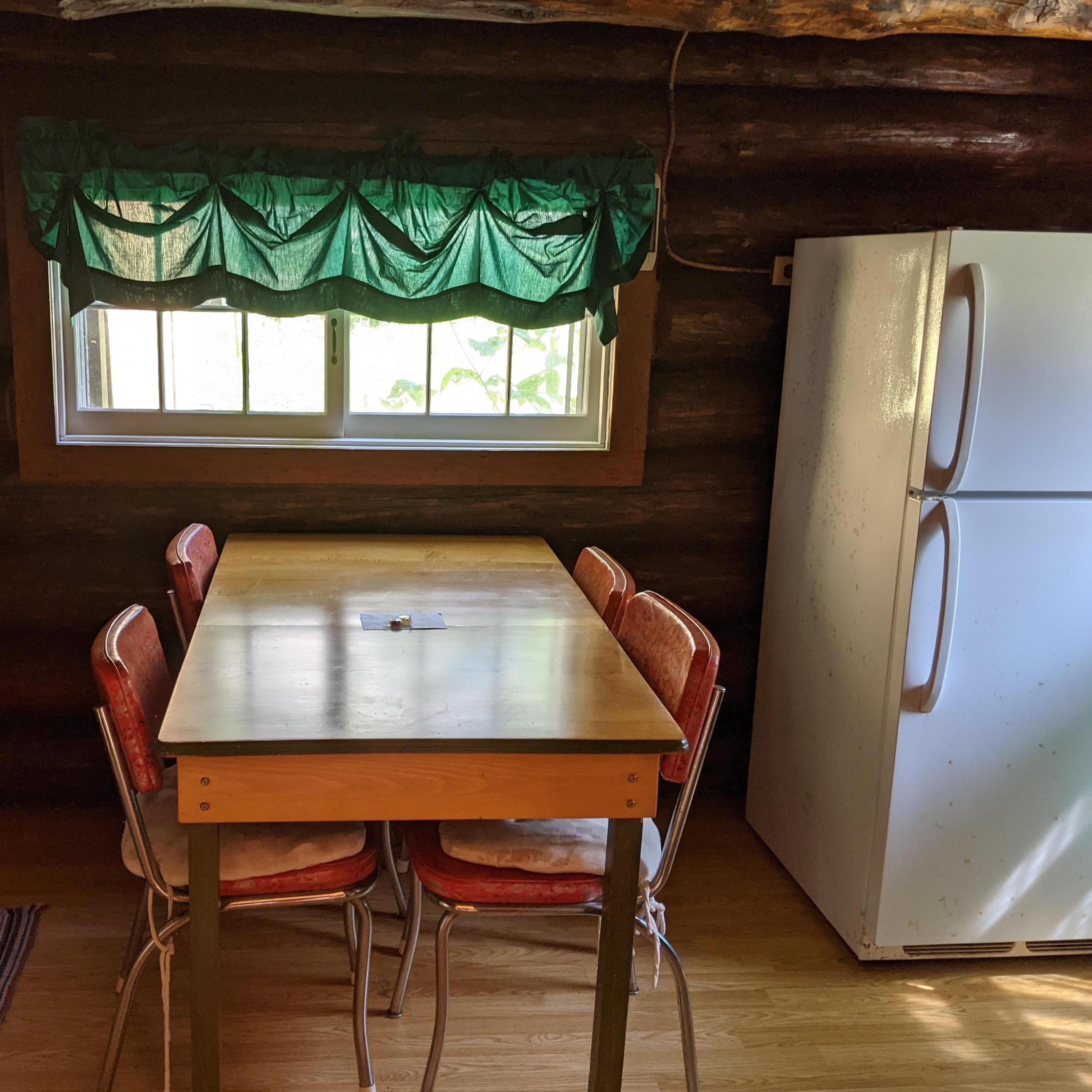 Log cabin (smallest cabin) 
Dining room and fridge