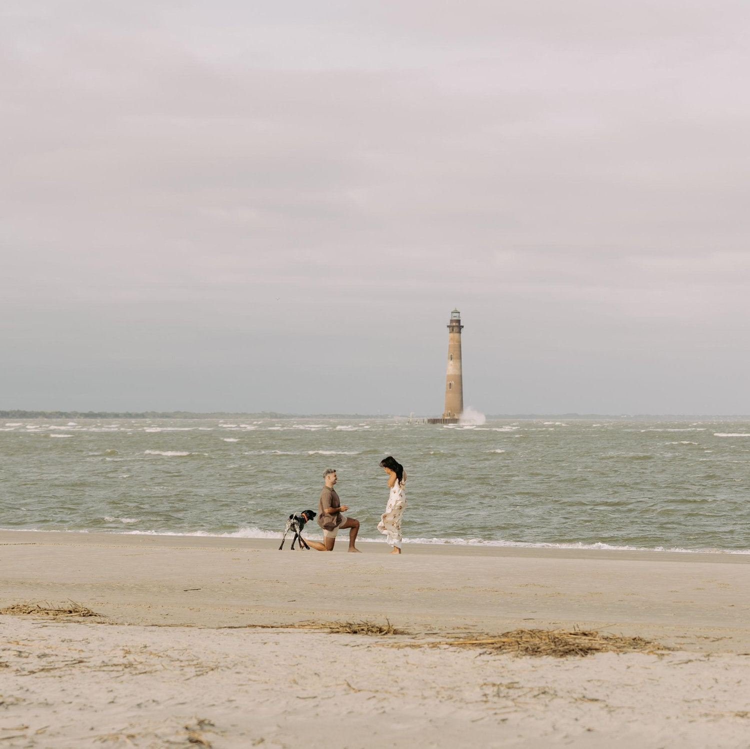 Austin proposed to Reyna on October 26, 2025 in front of the Folly Beach Lighthouse in Charleston with Maverick at his side.