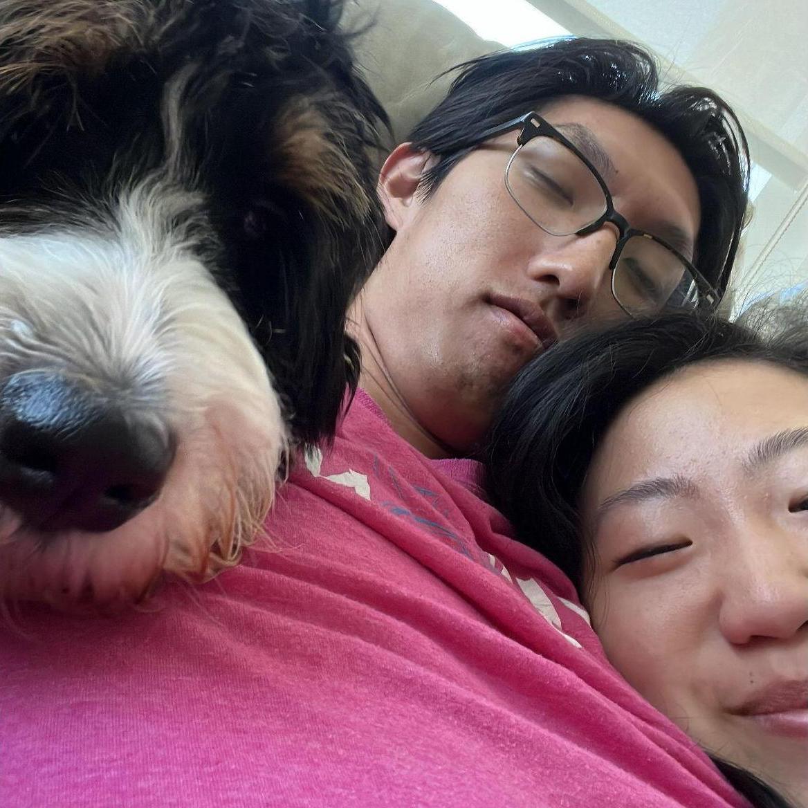Family snuggling on the couch