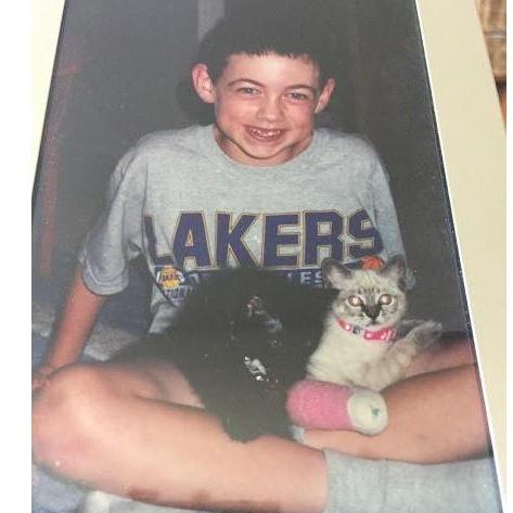 Andrew 8 years old with his childhood pets Snowy and Thunder