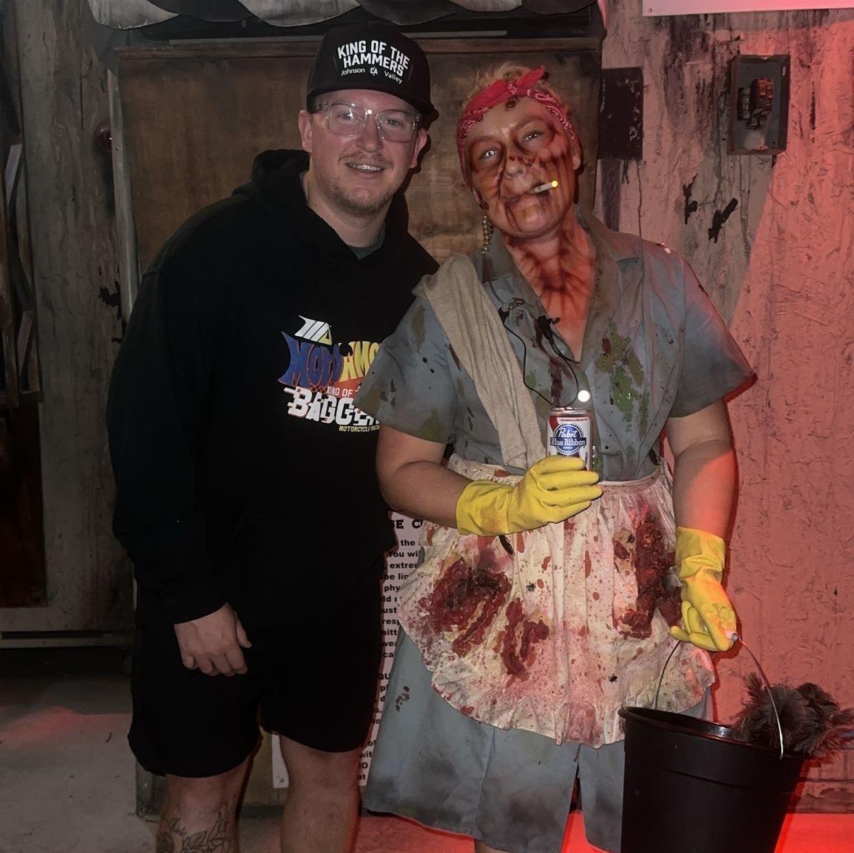 Erik supporting Maggie's spooky janitor character at Burial Chamber haunted house