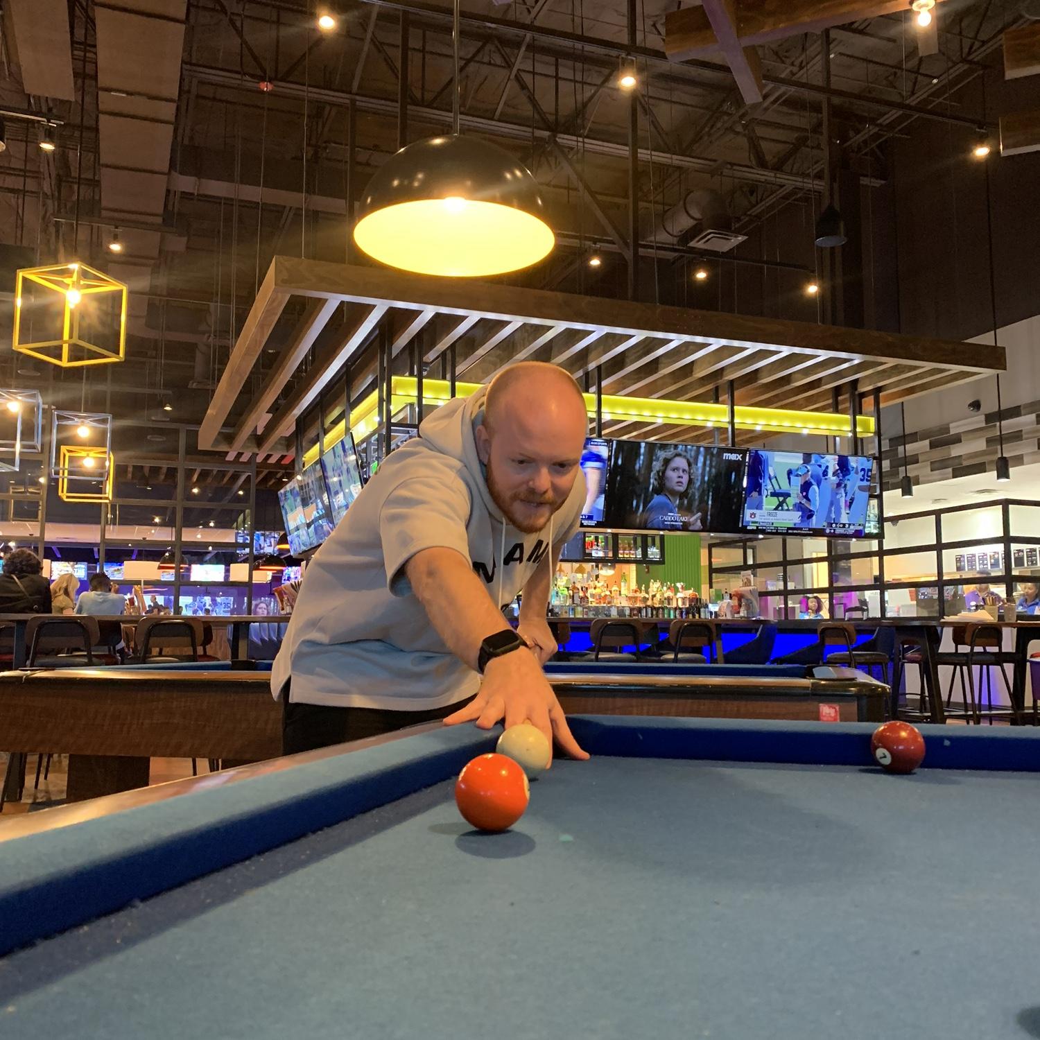 Michael playing pool for his bachelor party