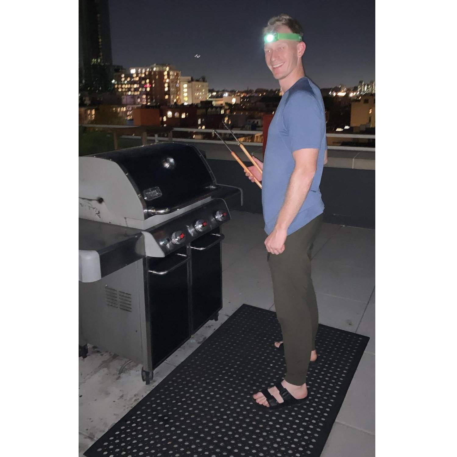 Andrew getting creative, grilling past sunset on our rooftop! September 2021
