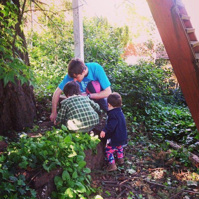 Brad searching for bugs with our roommates, Judah and Shoshana. We've spent the last five+ years living in their basement watching them grow.