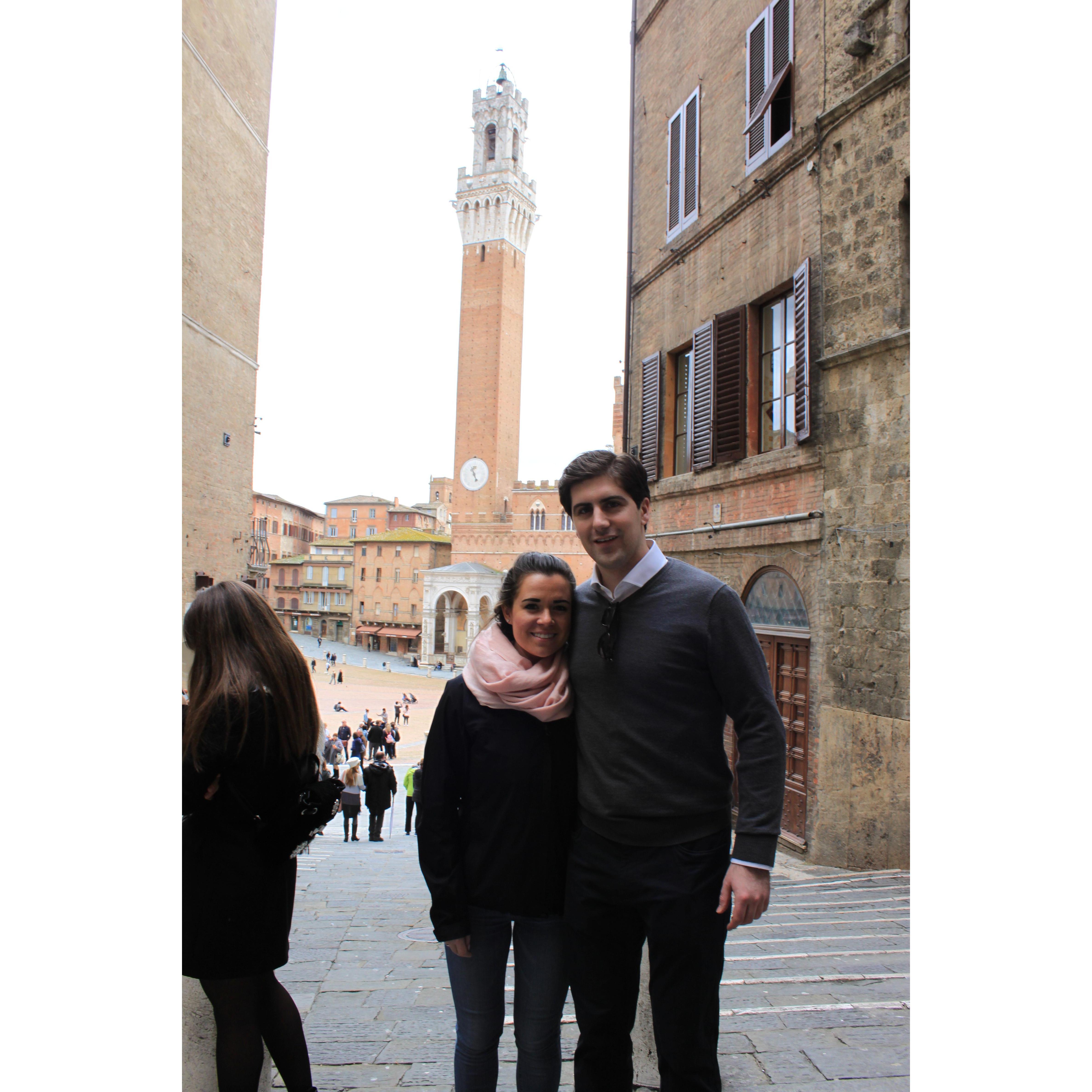 Inside the walls of Siena near Palio competition. 10 riders on bareback compete representing their Contrades.