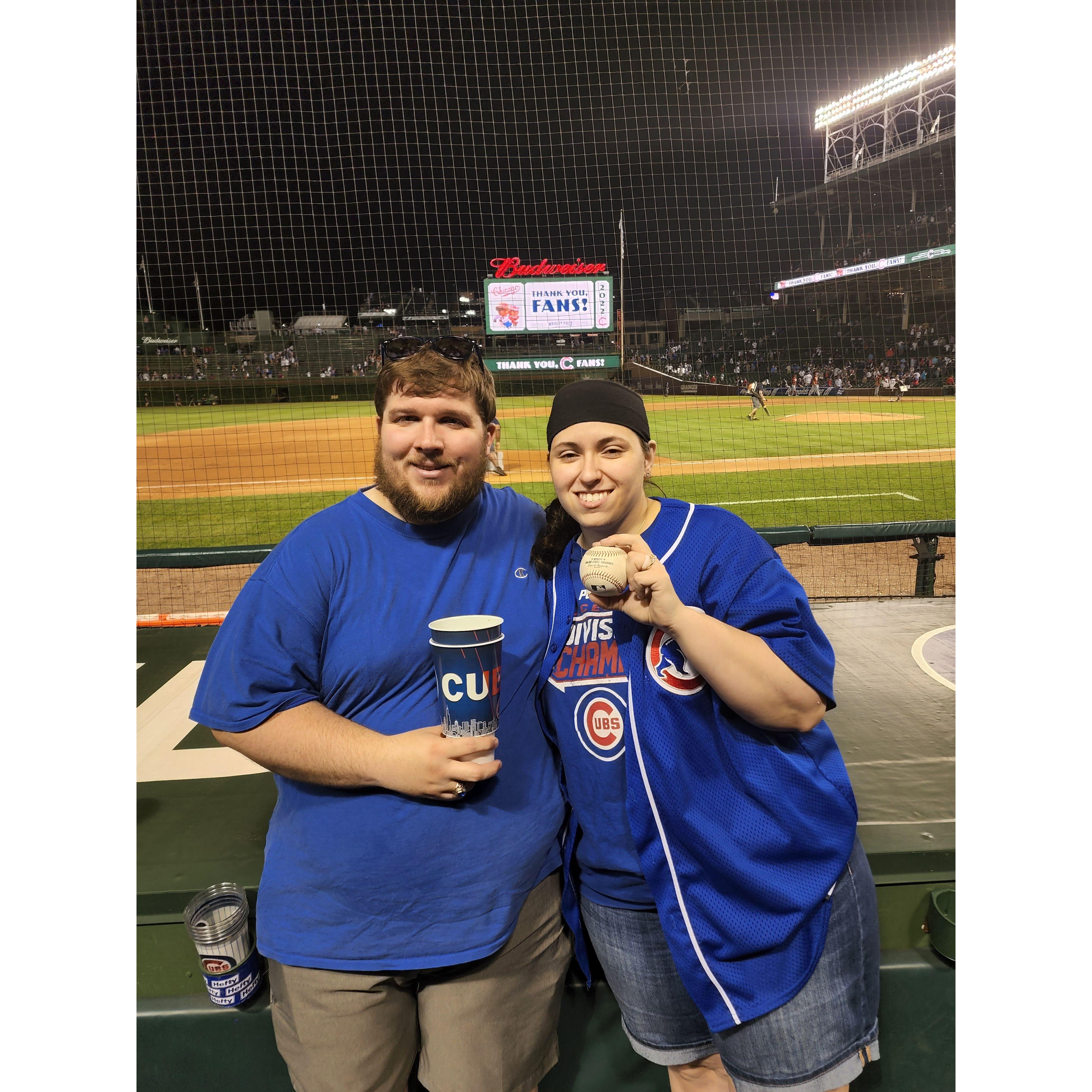 Front row at the Cubs game, Sara got a ball