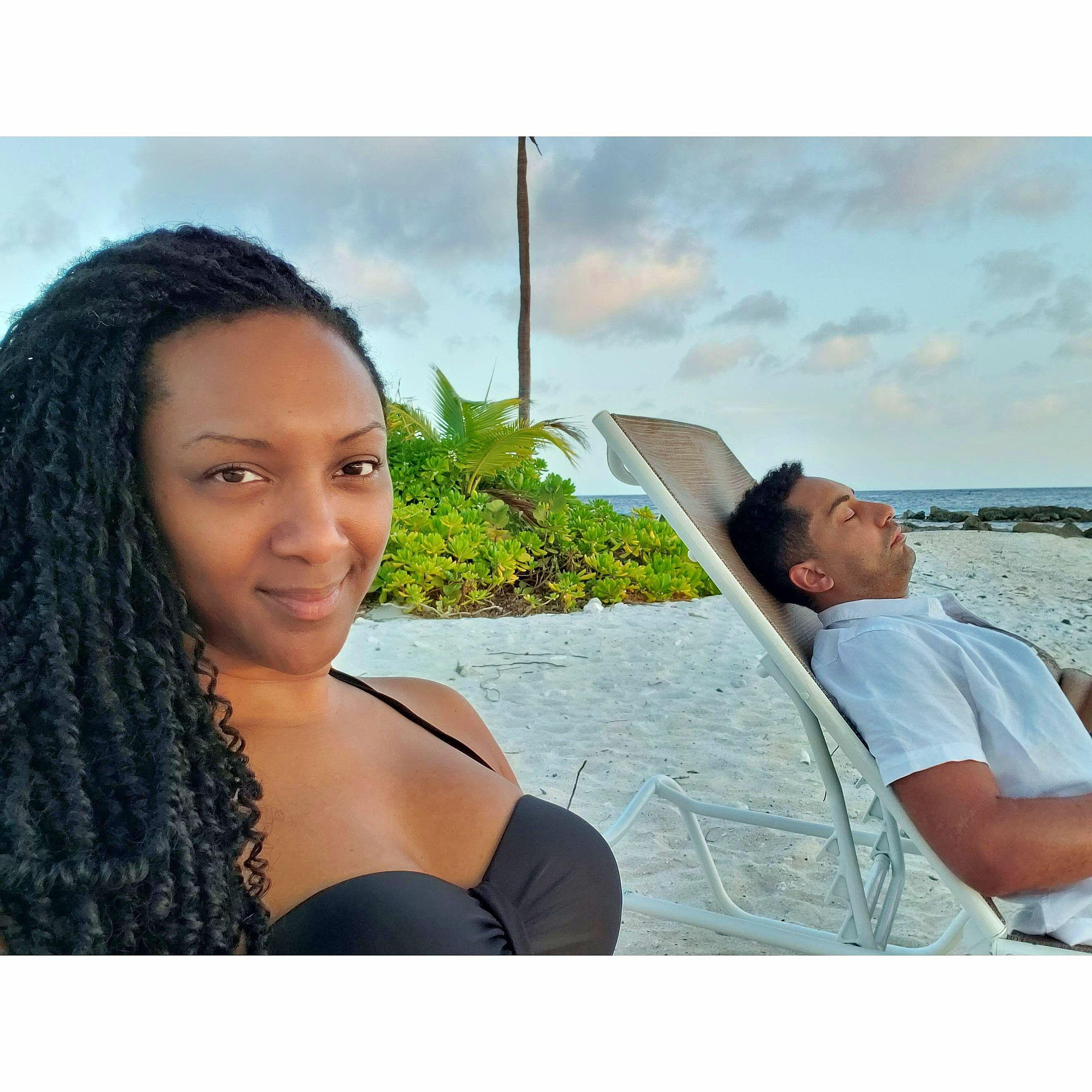 Beach bumming (i.e., Mackenzie reading while Lamar naps)