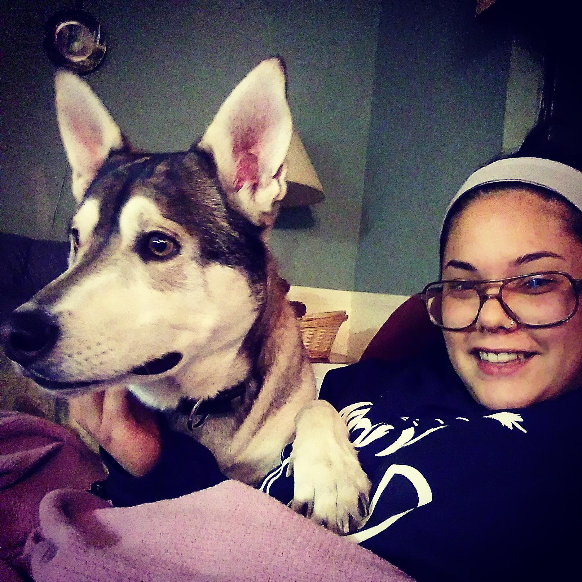 Just a girl enjoying cuddles from her favorite tripod, Tonto.
