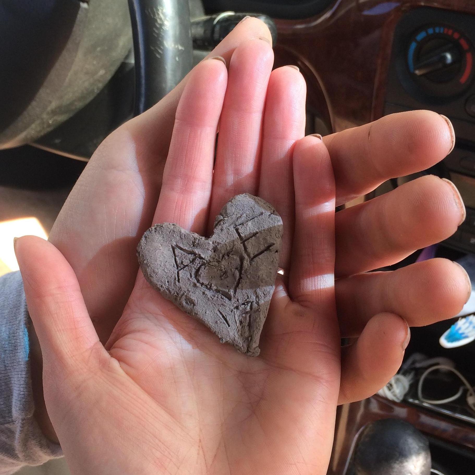 On the muddiest day yet, Alex got down on a knee and asked Ella to be his bride! Ella had made this little heart earlier in the day from the clay on her bike!