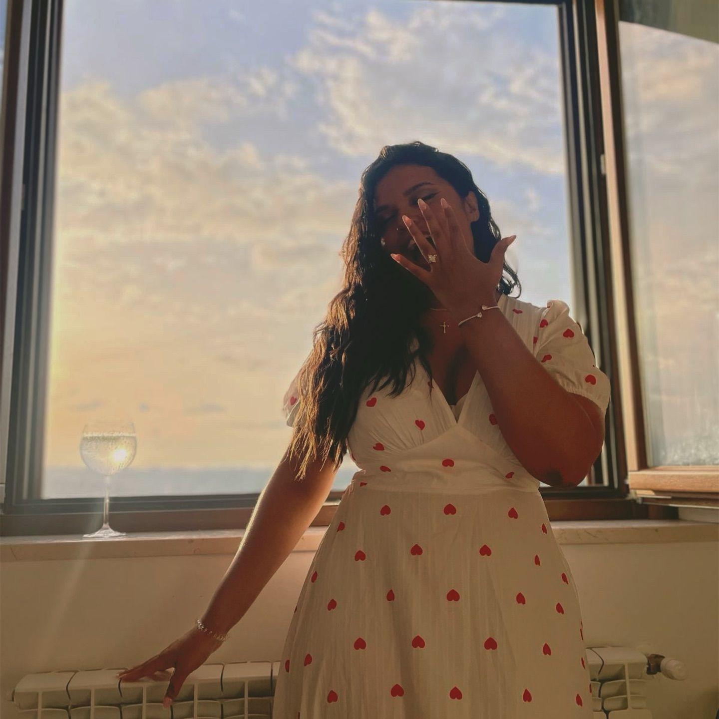 Debbie removing a fly from her face.