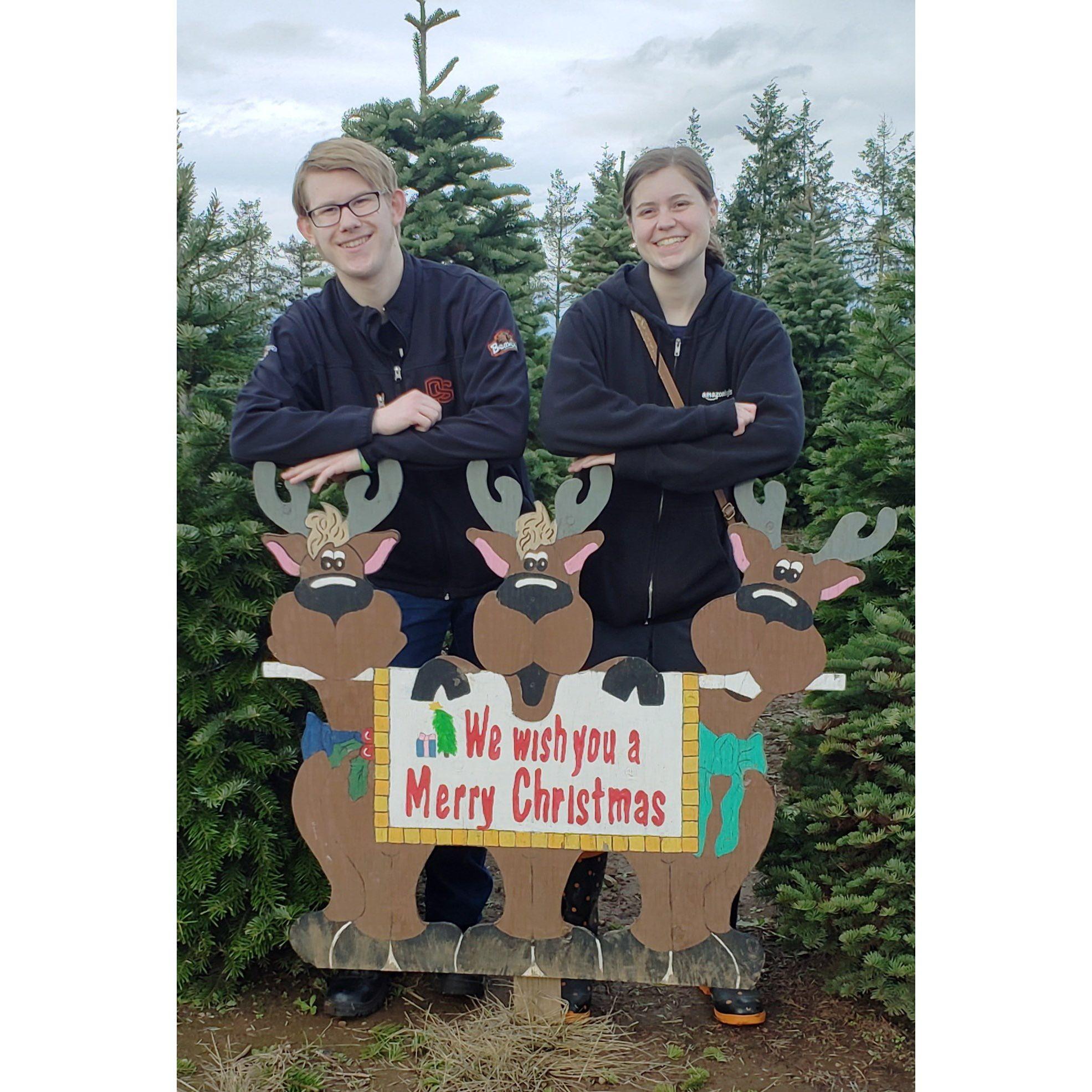 Posing for a cute Christmas photo and apparently looking a little awkward