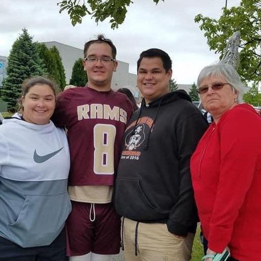 Kayla, Kevin, Tyler, and Grandma PJ at Kevin's senior night for lacrosse